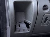the interior of a car with the door open showing the inside of it