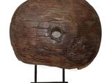 a wooden object with a hole in the middle of it