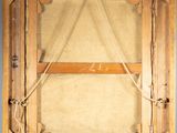 an old picture of a wooden frame with rope hanging from it ' s sides