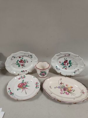 a table with a bunch of plates and bowls on it