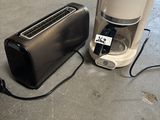 a toaster and a toaster sitting on the floor