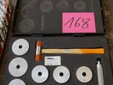 a case with a hammer, a hammer, and other tools in it