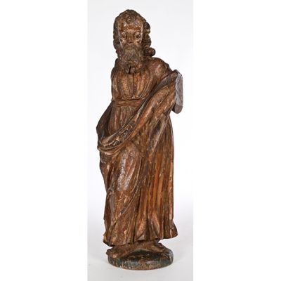 a statue of a man with a beard holding a book
