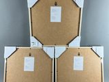three pieces of cardboard are stacked on top of each other