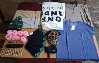 a pile of clothes and other items on a table
