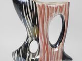 a black and white vase with a zebra print design on it