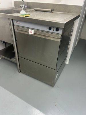 a kitchen with a sink and a dishwasher in it