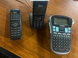 several cell phones are sitting on a table next to each other