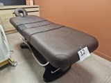 a massage table with a price tag on it in a room