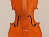 an old violin with a bow hanging from the back