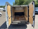 a white van with a wooden door open in a parking lot