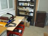 a desk with a lot of boxes on it in a room