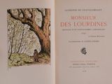 an open book with a picture of a tree in it