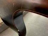 a close up view of a wooden table with a black top