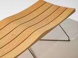 an image of a wooden bench sitting on top of a metal stand