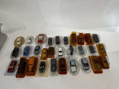 a lot of toy cars that are sitting on a table