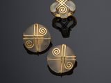 three gold and mother of pearl earrings and a ring