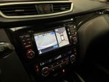 the dashboard of a car with a gps device in the center