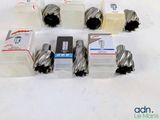 a lot of different types of drill bits on the table