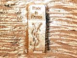 a picture of a piece of wood that has a sign on it