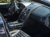 a car dashboard with a steering wheel and a dash board