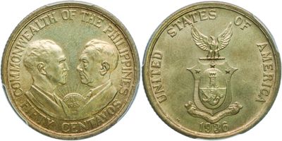 a close up of two gold coins with a man and a woman on them