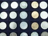 a lot of different coins in a black box