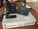several electronic devices are sitting on top of a table in a store