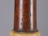 a close up of a wooden stick with writing on it