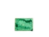 a close up of a green glass tile on a white surface