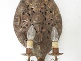 wall sconce with two light bulbs attached to it on a white wall
