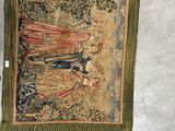 an image of a tapestry hanging on a wall next to a pair of scissors