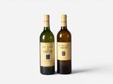 two bottles of wine sitting next to each other on a white surface