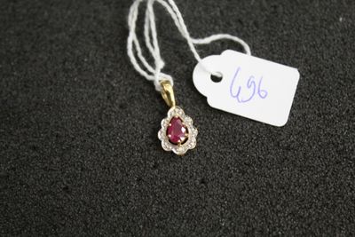 a close up of a necklace with a tag attached to it