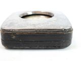 a small metal box that is sitting on a table