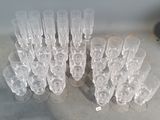 a lot of empty wine glasses on the table