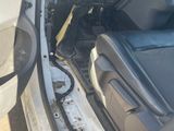 the interior of a car with the door open showing the inside of it