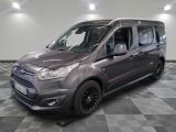 ford transit van parked on a checkered floor in a showroom