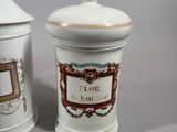 two jars that are sitting next to each other on a table