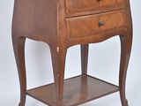a small wooden table with a drawer on top of it