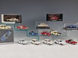 a lot of cars that are on display in a display case