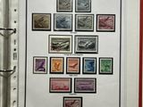 an open book with a bunch of different stamps on it