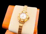 a watch that is sitting on top of a wooden stand