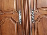 an image of a wooden cabinet with a door handle