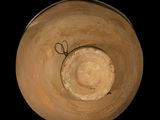 a clay bowl with a wire in the middle of it