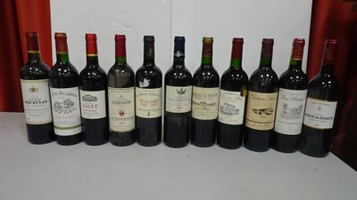 several bottles of wine are lined up in a row on a table