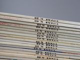 several books stacked on top of each other on a table