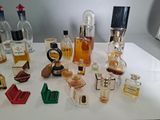 many different types of perfume bottles on the table