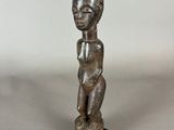 an image of a statue of a woman with a baby on her lap