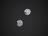 a pair of diamond earrings on a black background